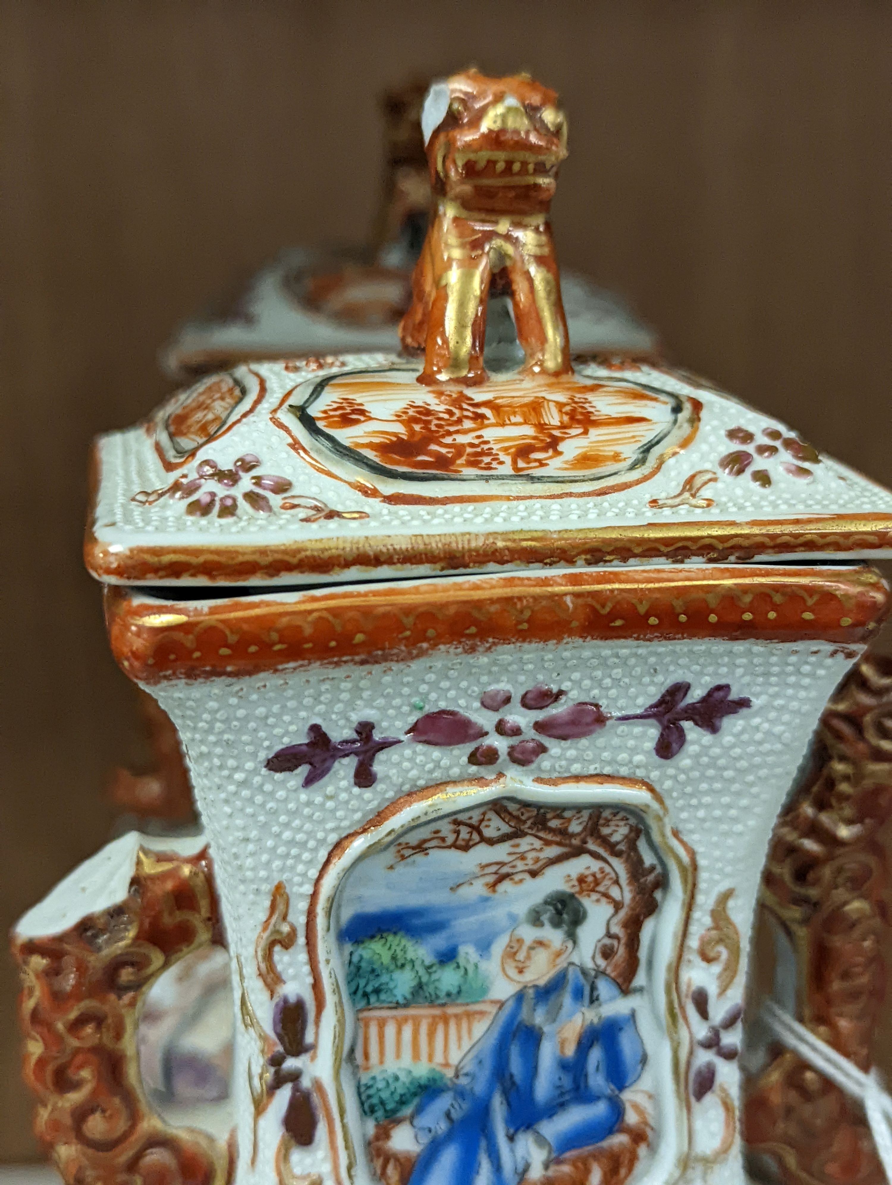 A pair of 18th century Chinese export square form famille rose vases and covers with phoenix handles - 24.5cm tall